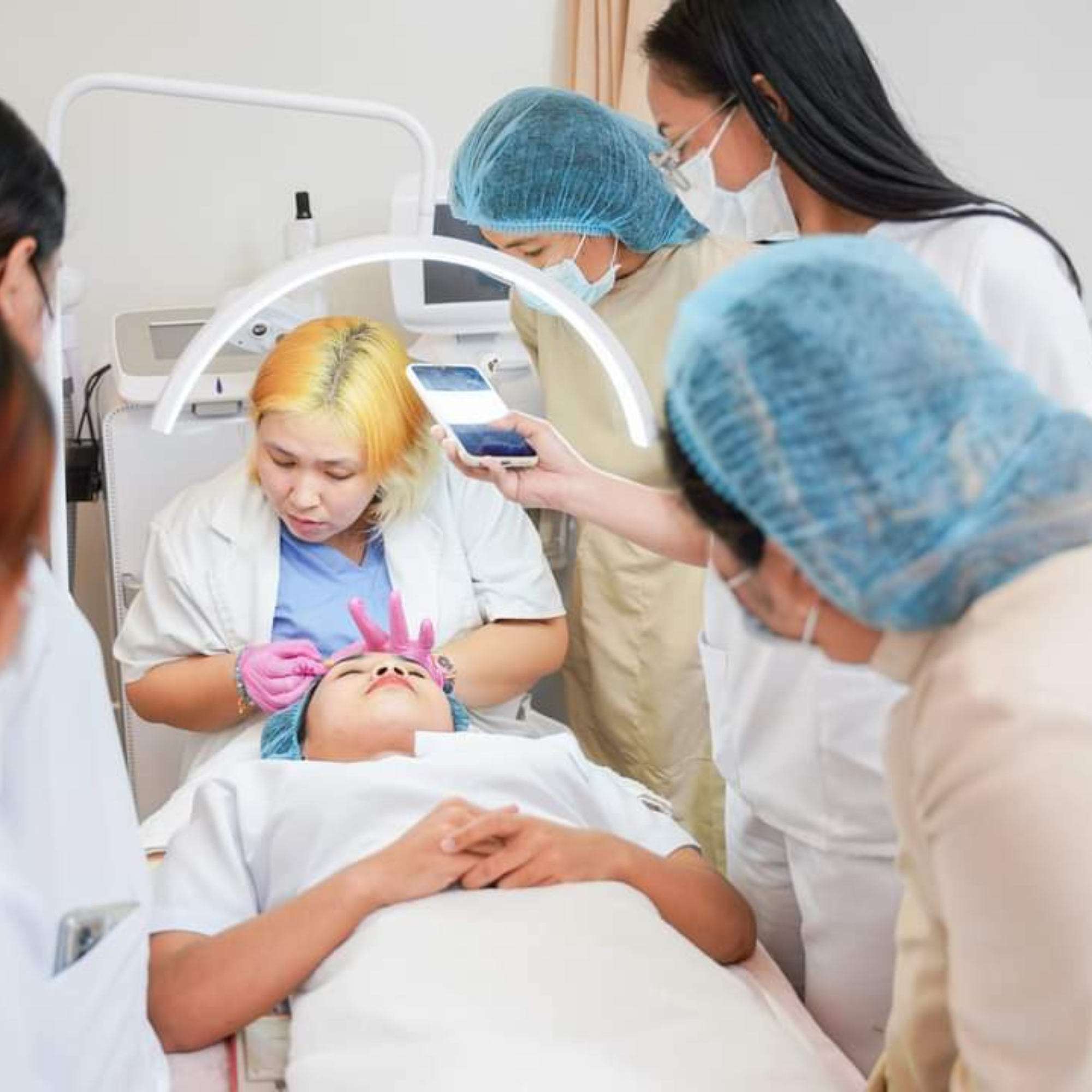 Medical aesthetics training with professional staff and patient