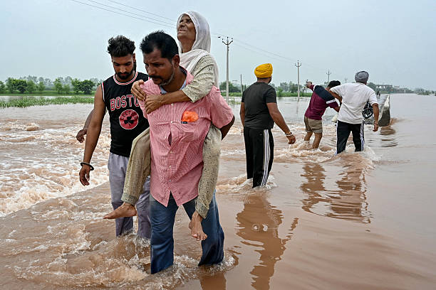 People helping each other in flood