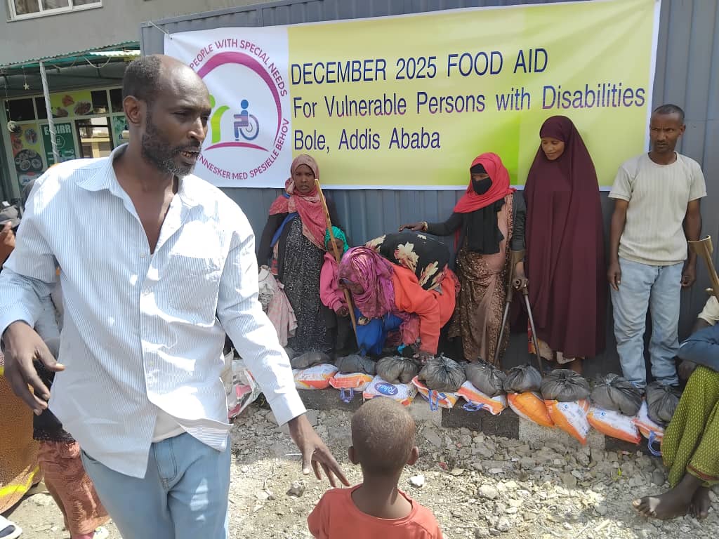 Women and children at food aid event