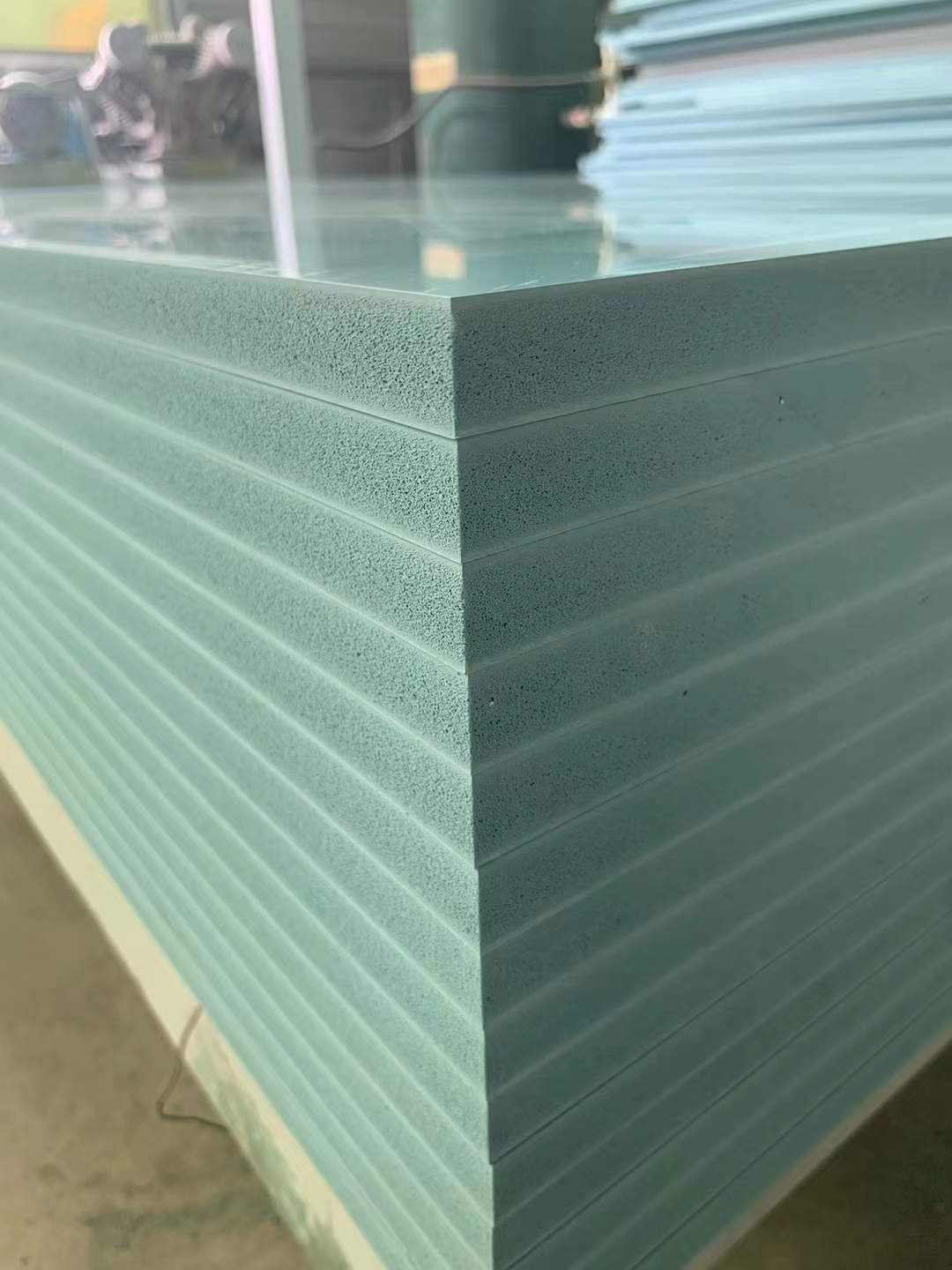 Plastic PVC beam formwork panels stacked in factory with ribbed texture surface
