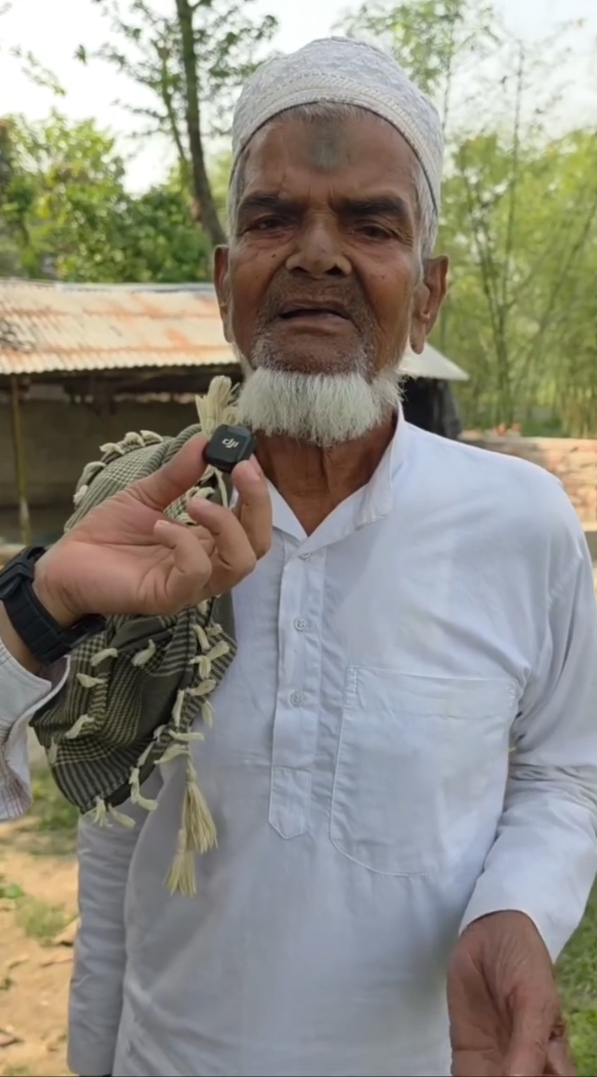 Old man Imam Sahib standing outdoors