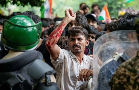 Injured protester raising fist