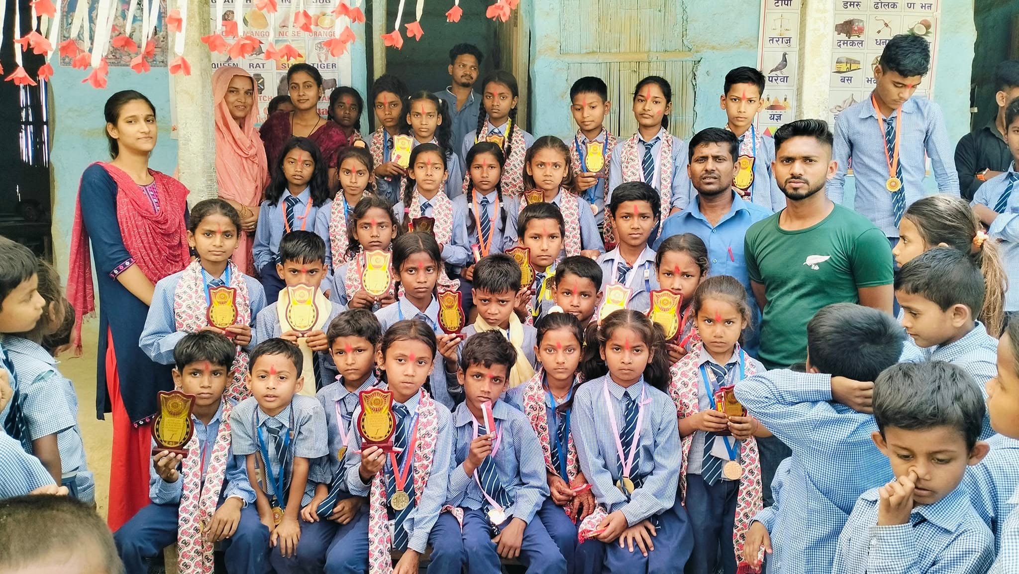 Students with medals and certificates