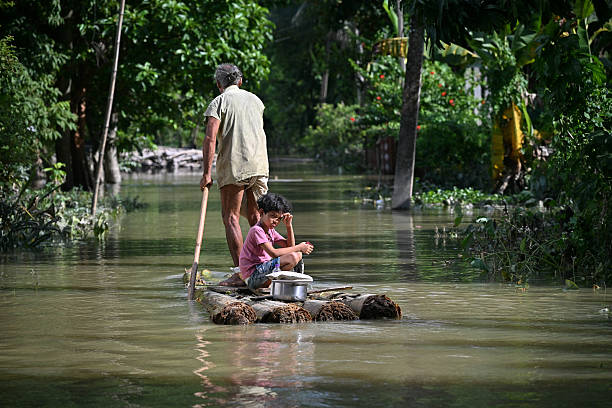 Flood survivor with child on raft