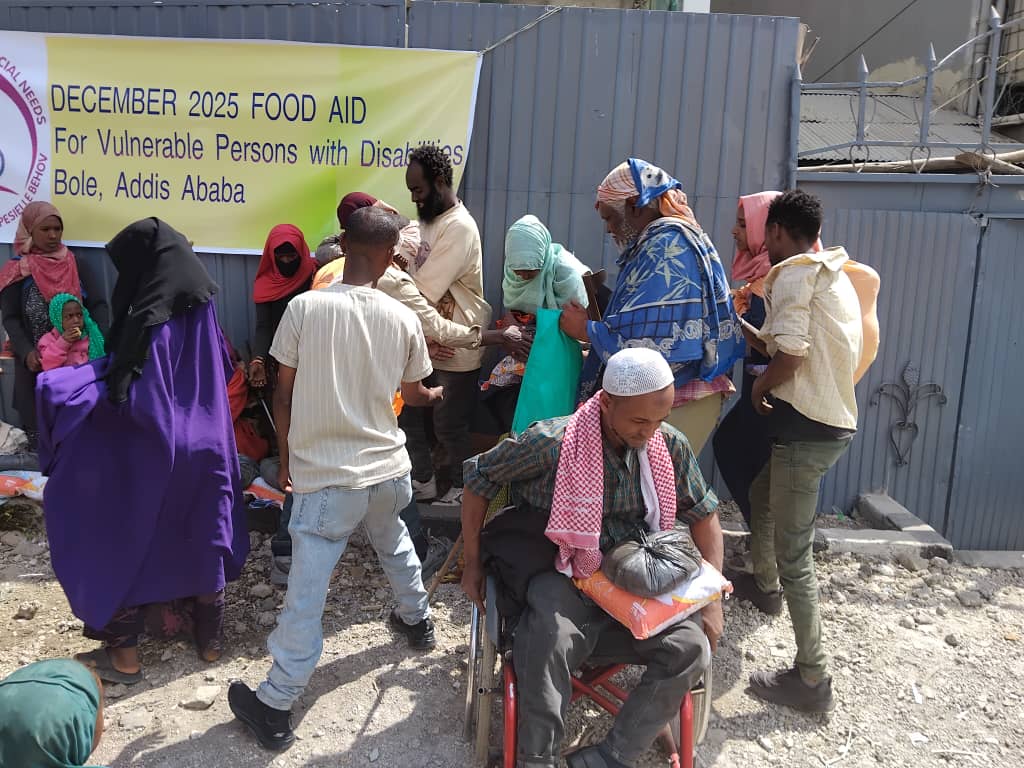 Wheelchair users receiving food aid