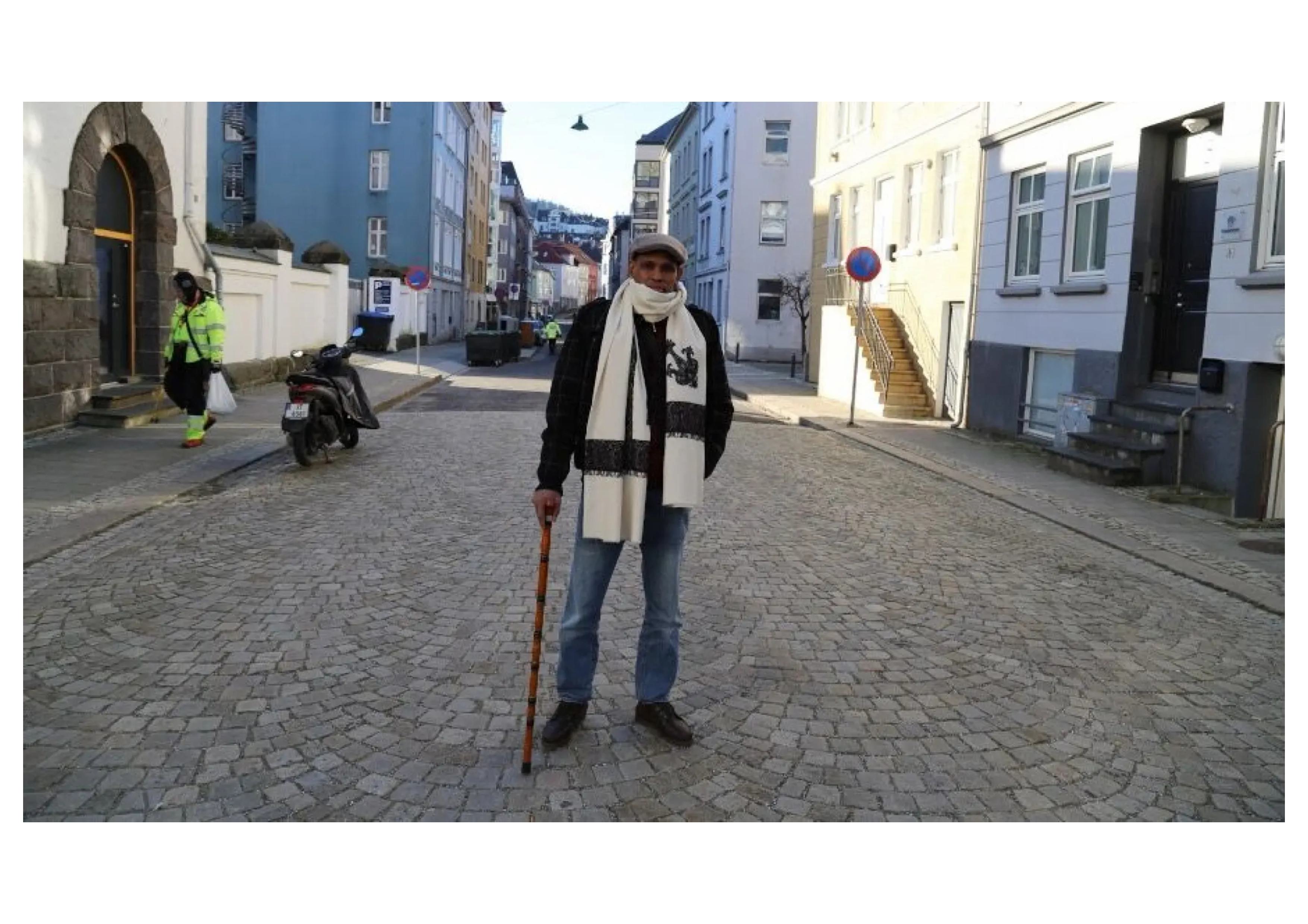Community member using a cane on the streets of Bole, Addis Ababa