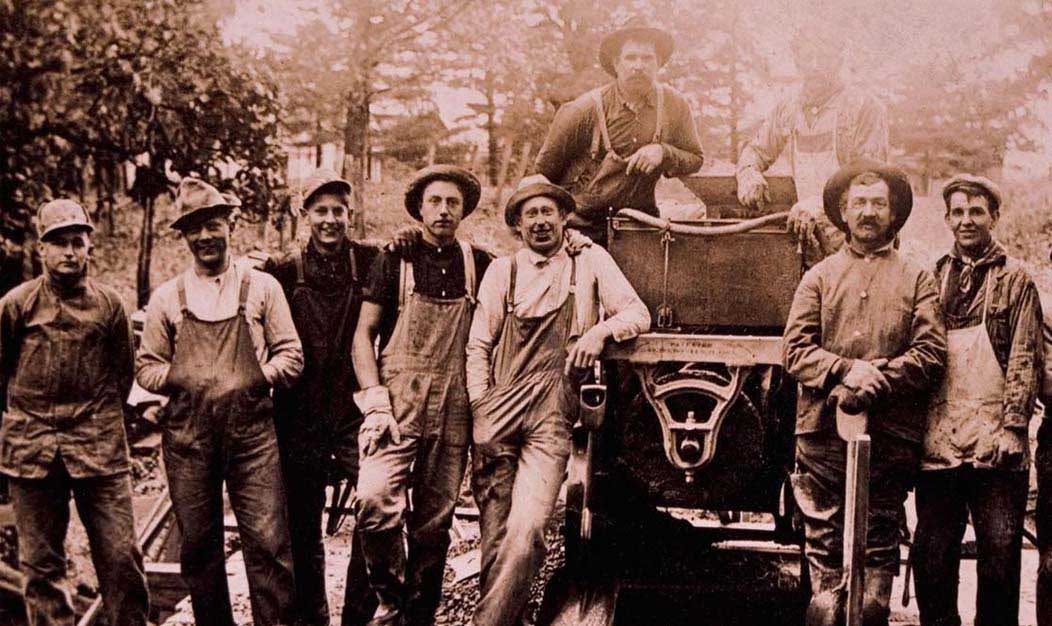 Vintage workers in denim overalls