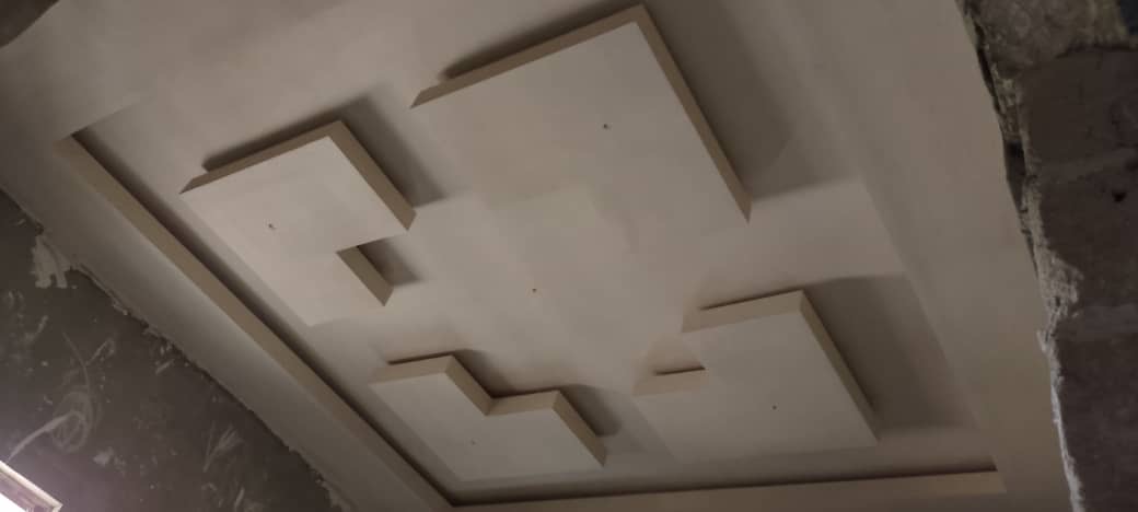 After: Finished geometric POP ceiling design