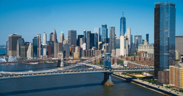 New York City Manhattan skyline with Brooklyn Bridge and skyscrapers representing nationwide commercial landscaping coverage