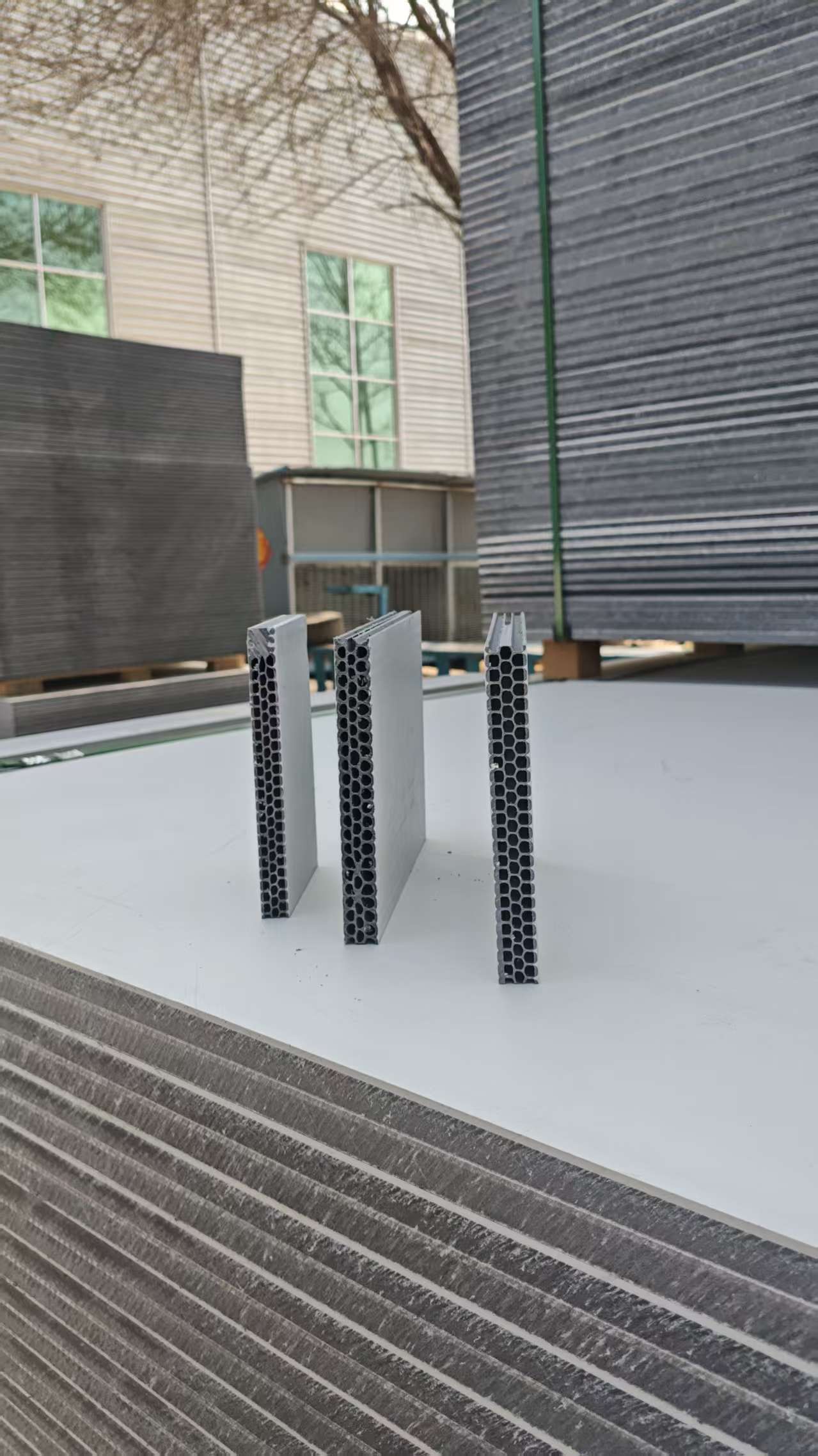 Hollow plastic formwork panels displayed outdoors showing honeycomb core structure
