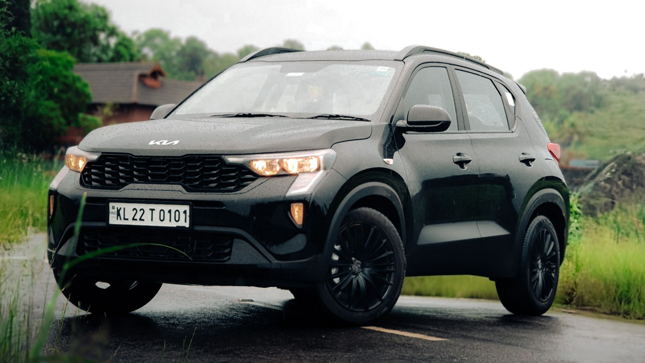 Kia Carens black SUV