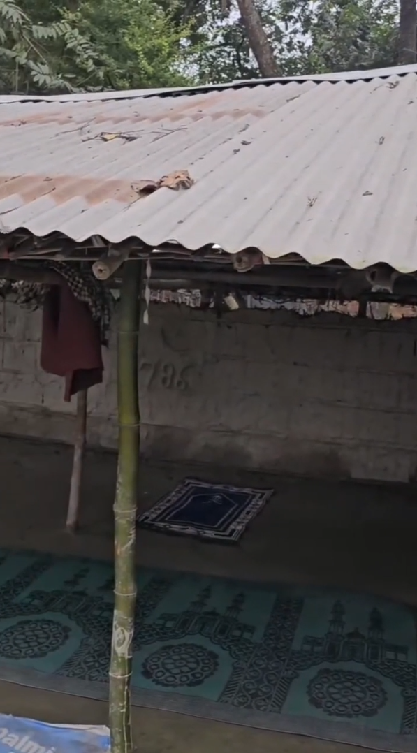 Inside the hut masjid with prayer mats