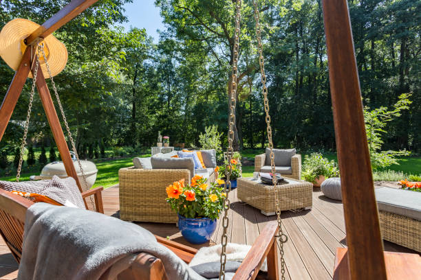 Outdoor living space with patio seating and landscape lighting in Houston