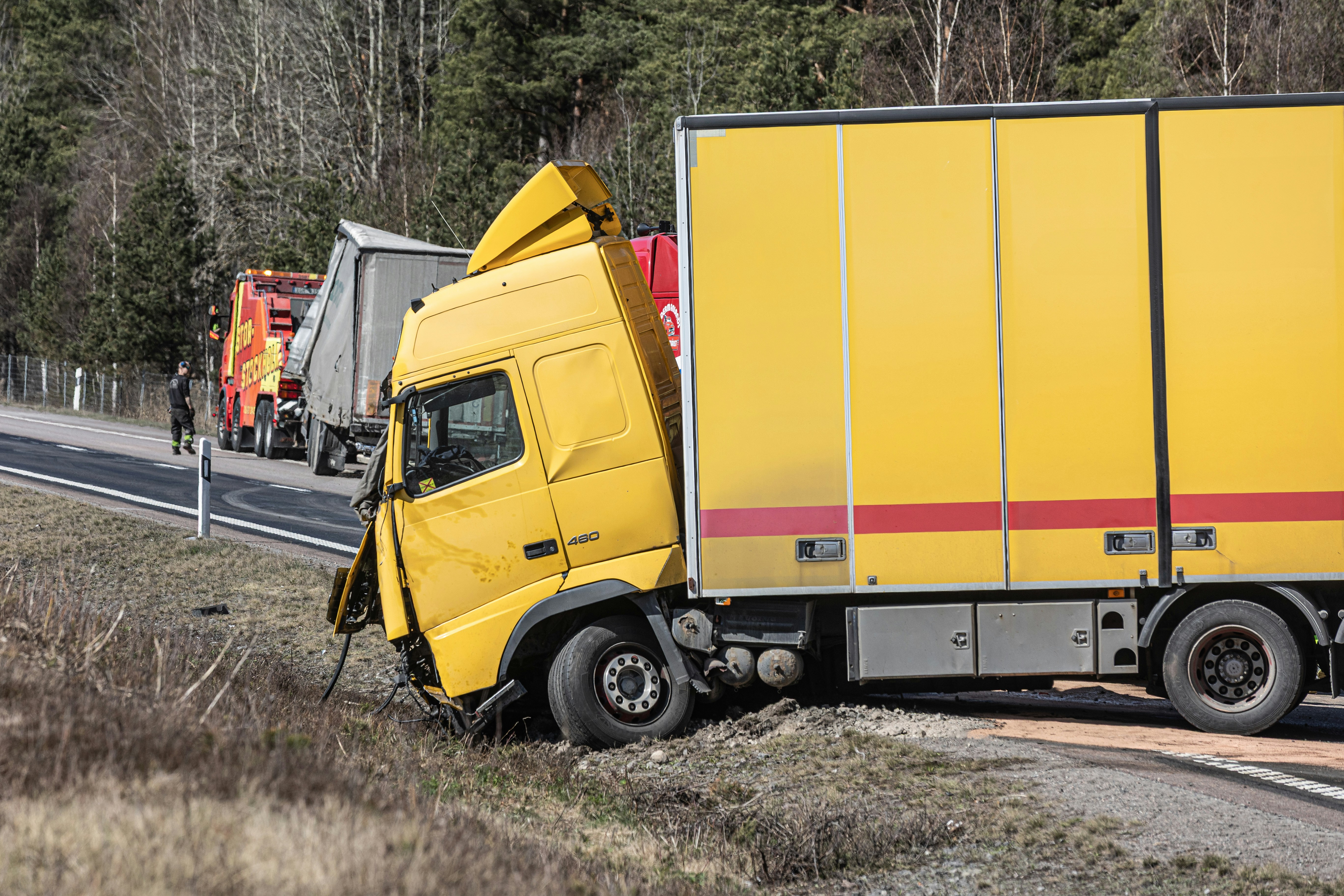 Damaged commercial truck after a roadway accident
