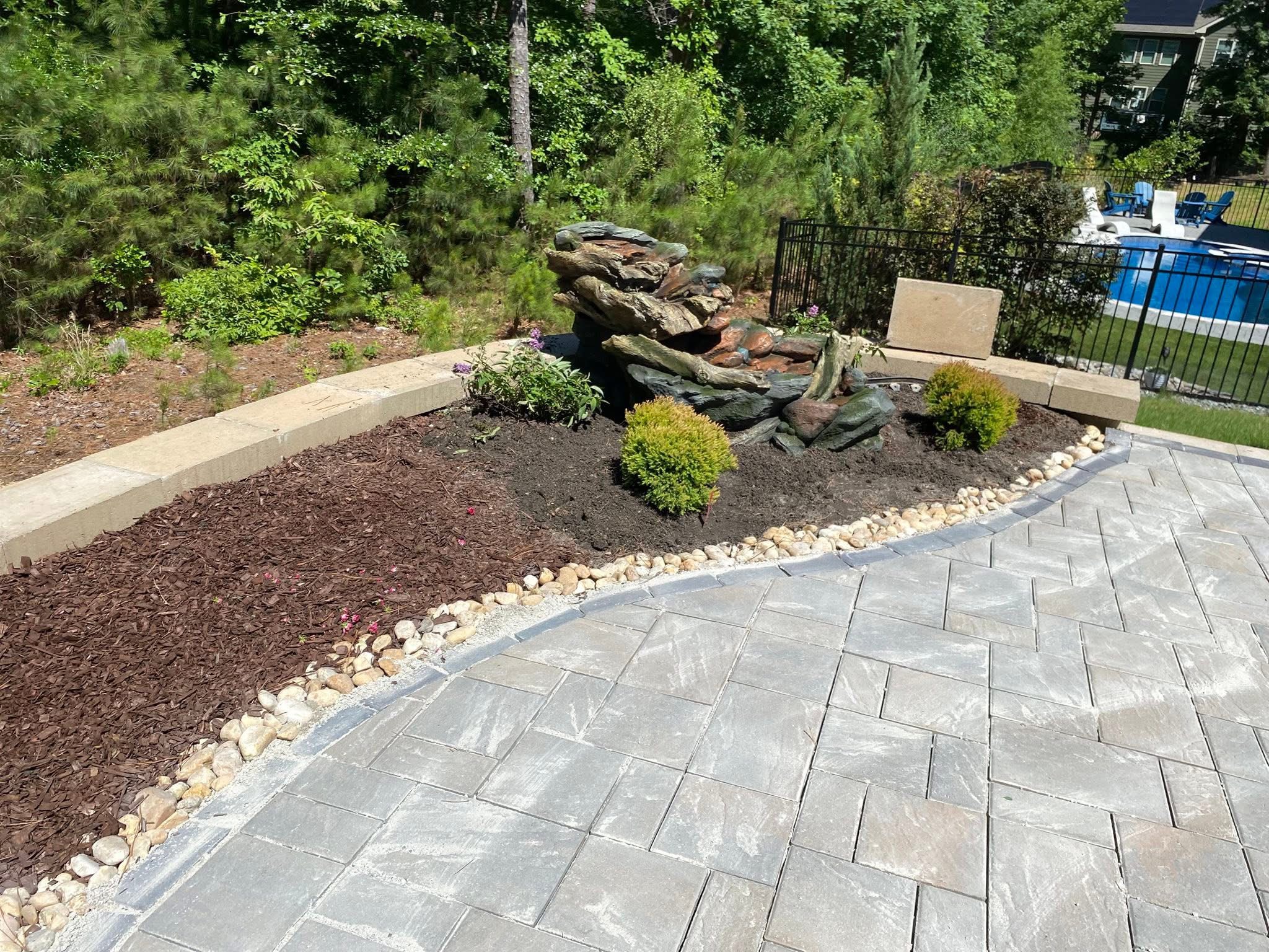 Stone walkway with flower beds