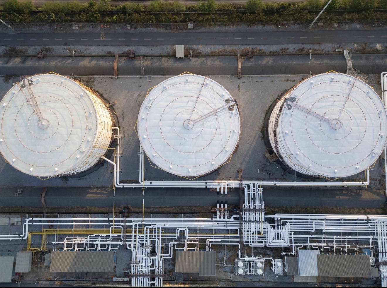 Industrial facility with storage tanks and piping