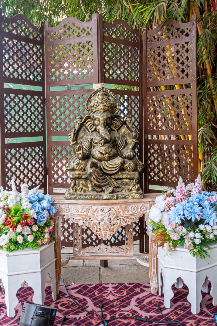 AC Banquet Hall in Nashik – Traditional Ganesh setup with flowers at Vrindavan Greens