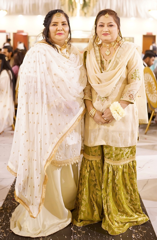 Two women in ornate traditional garments