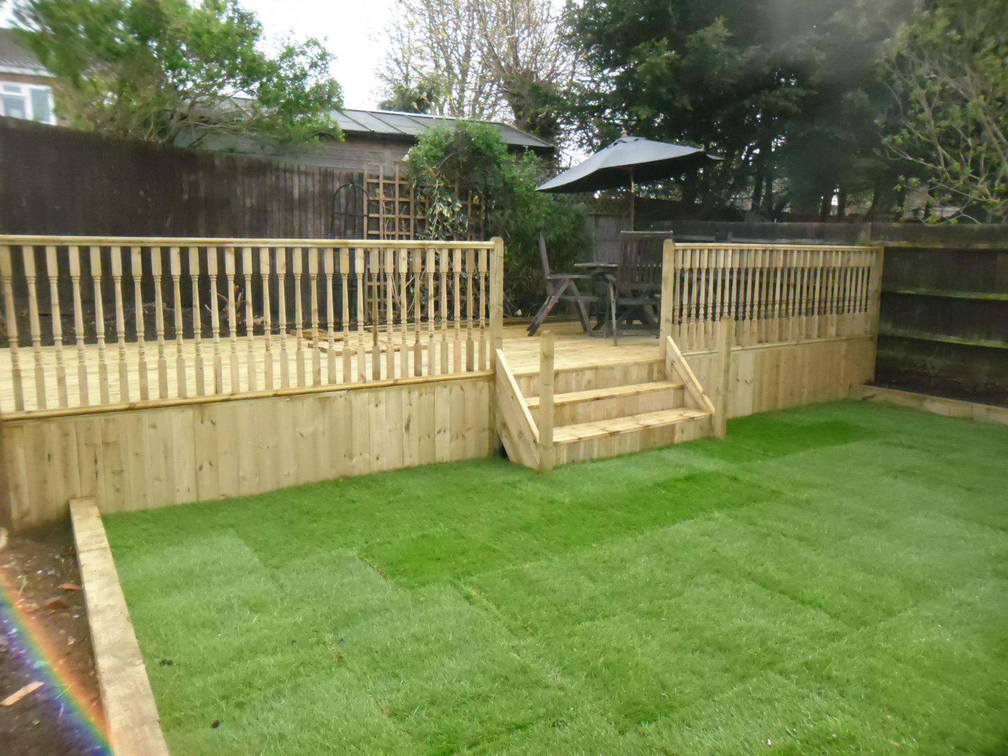 Wooden deck and patio with umbrella