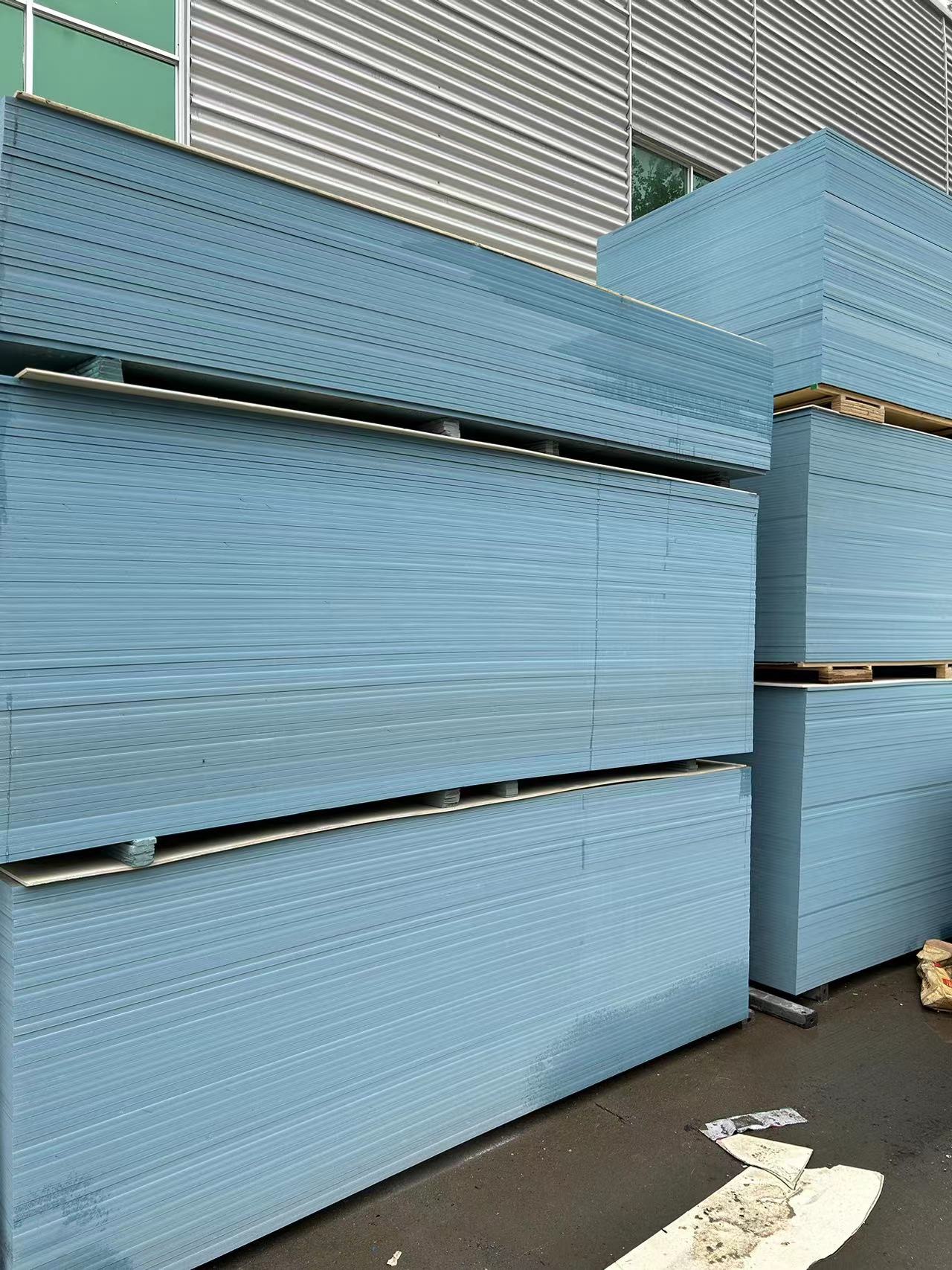 PVC beam formwork panels stacked on pallets in factory