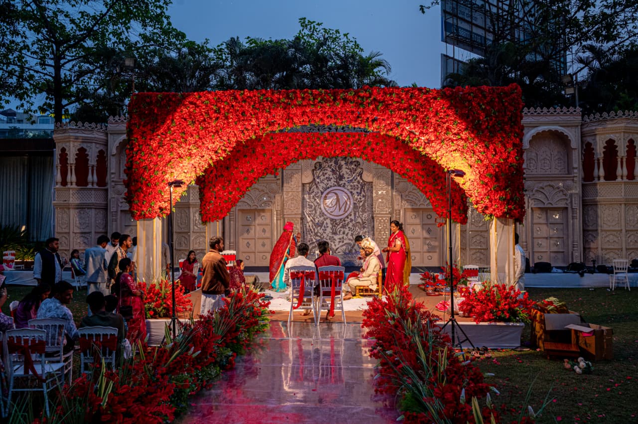 Best Banquet Hall in Nashik – Grand outdoor wedding ceremony with red floral arch at Vrindavan Greens Gangapur Road