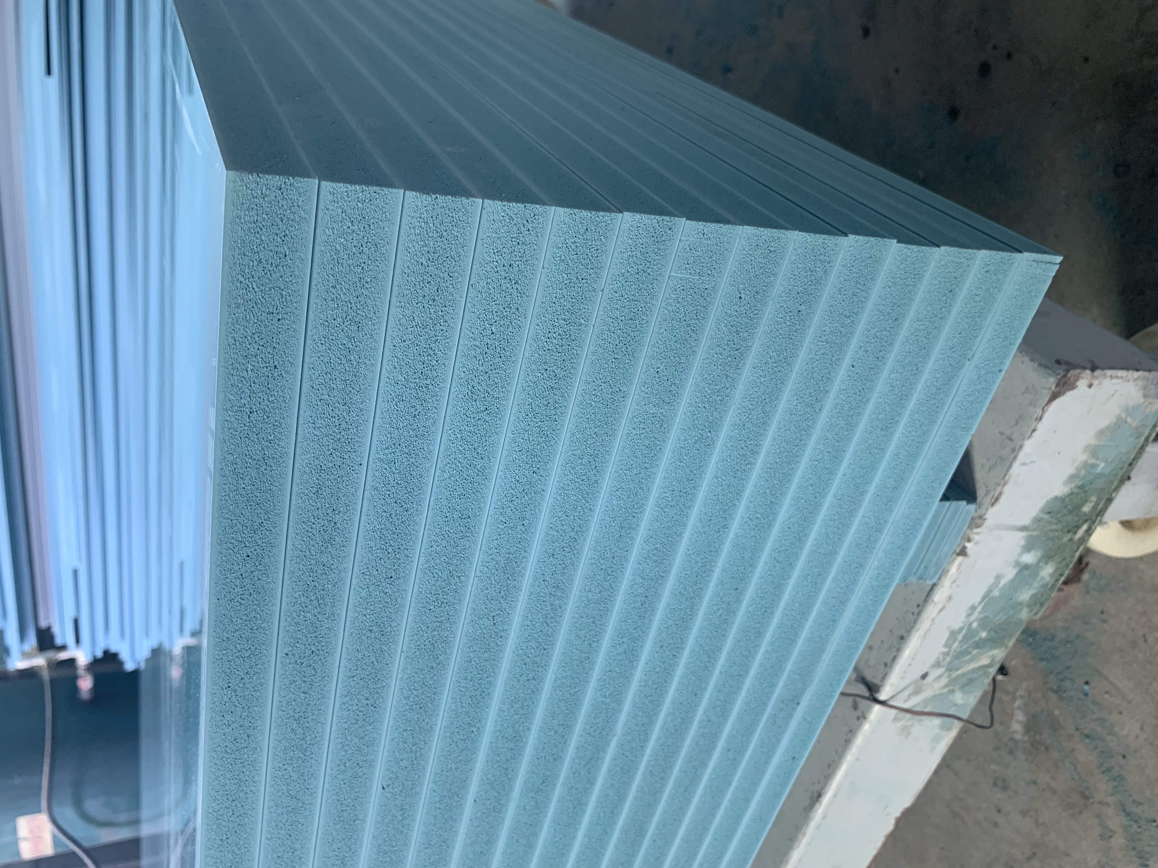 Clean stack of PVC beam formwork panels in warehouse