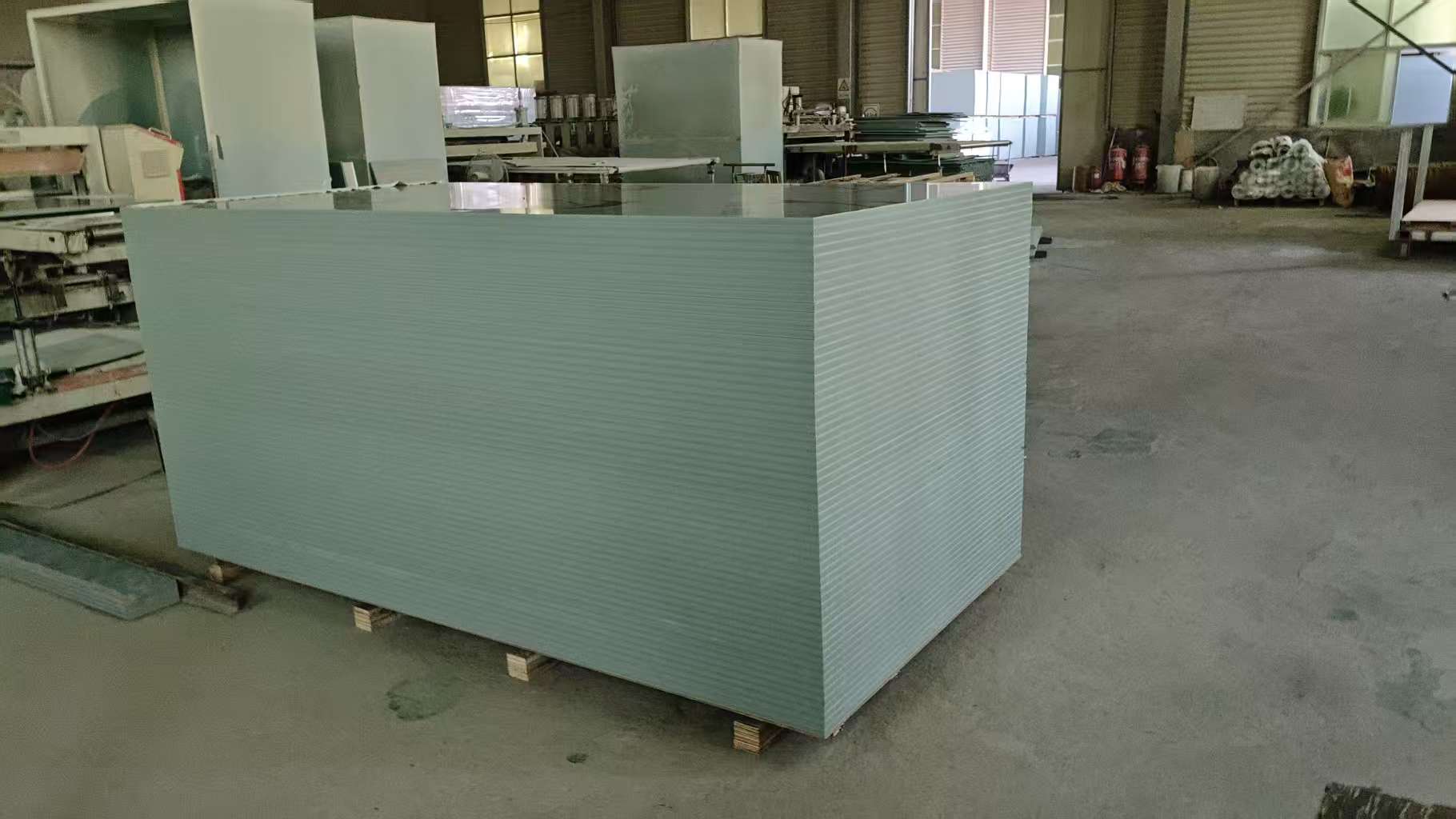 Finished light blue PVC beam formwork panel placed on wooden pallet for packaging