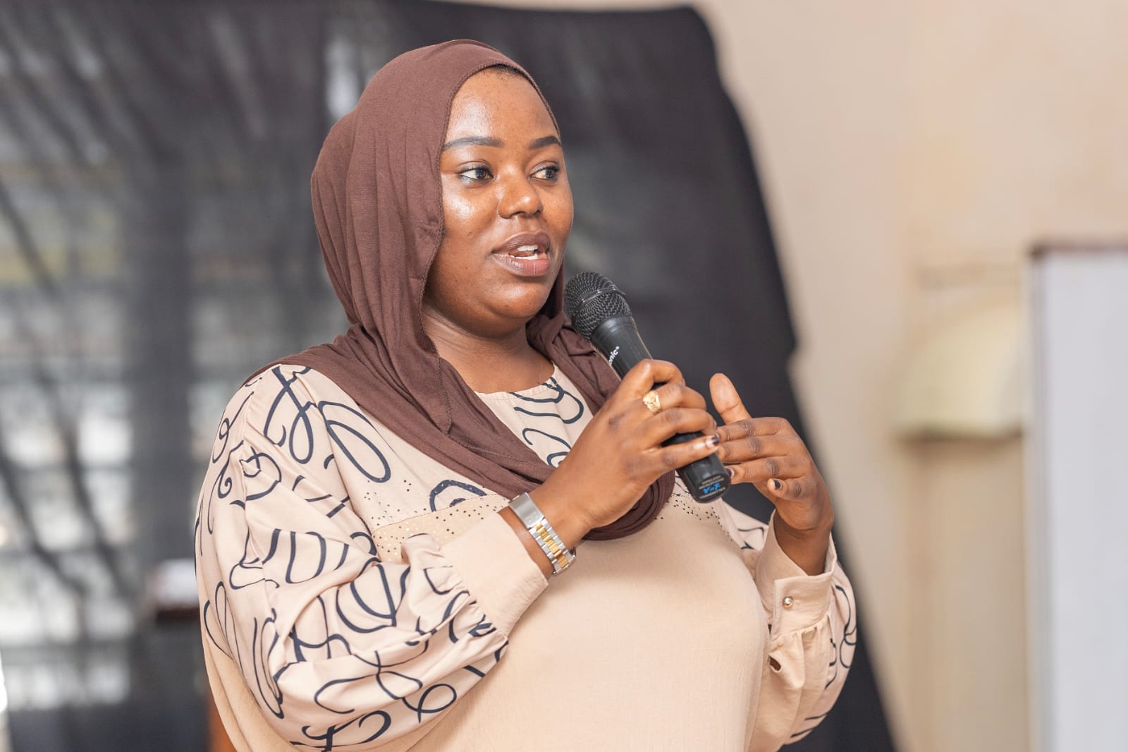 Woman Speaking with Microphone