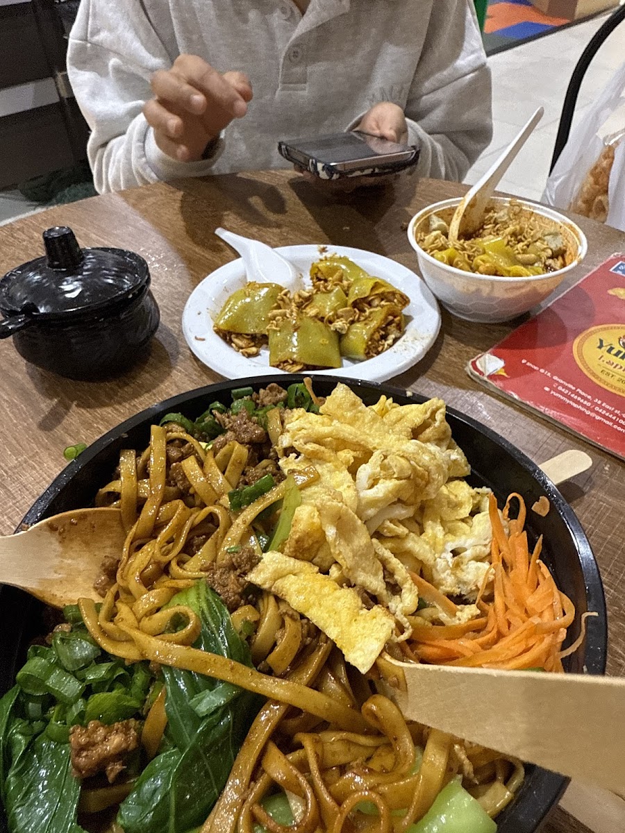 Yummy Laphing delicious food spread — noodles, momo, and Nepalese dishes on the table