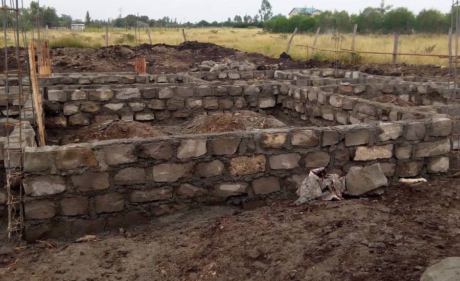 Stone block wall foundation under construction