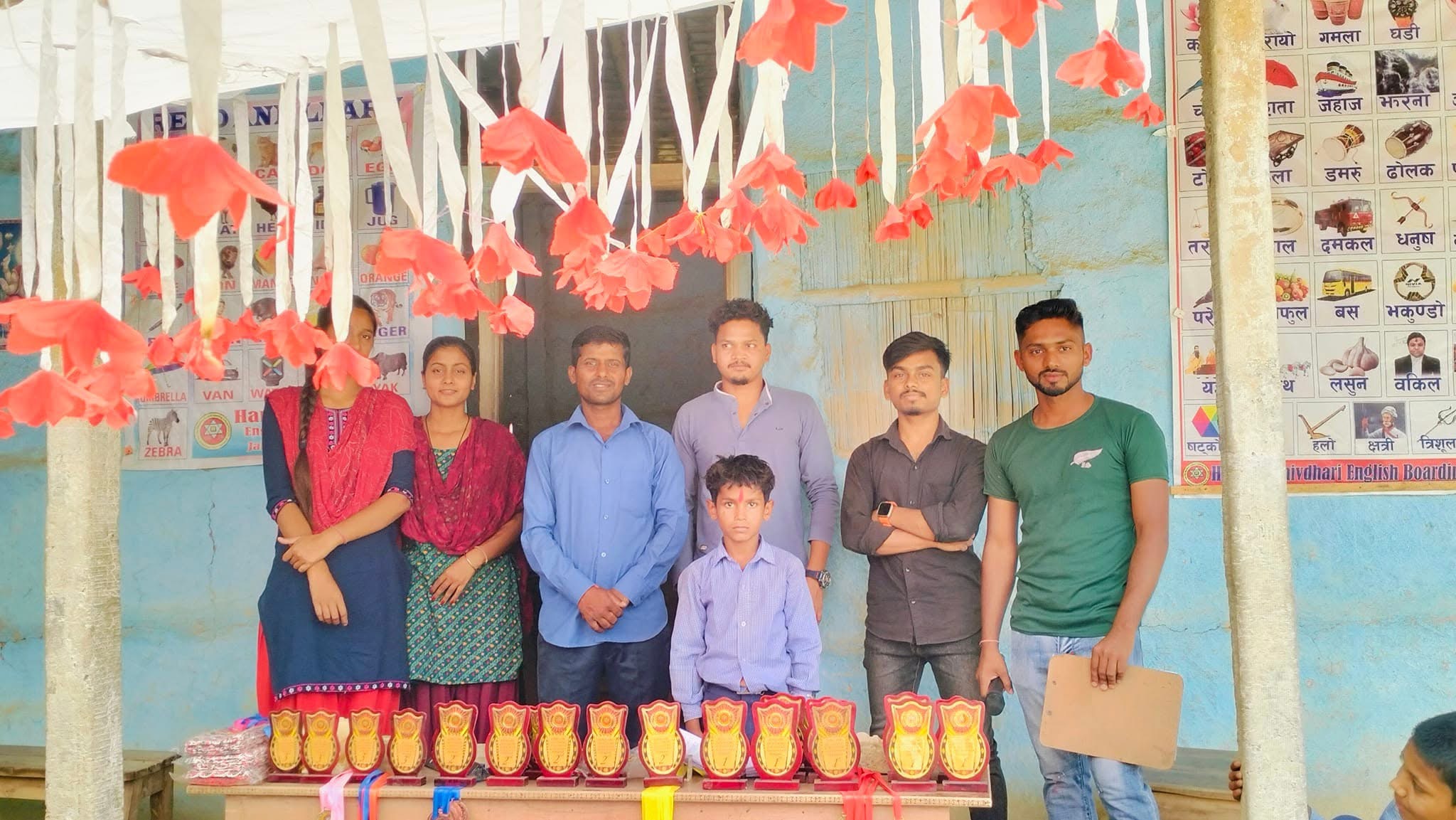 Group photo with trophies and awards