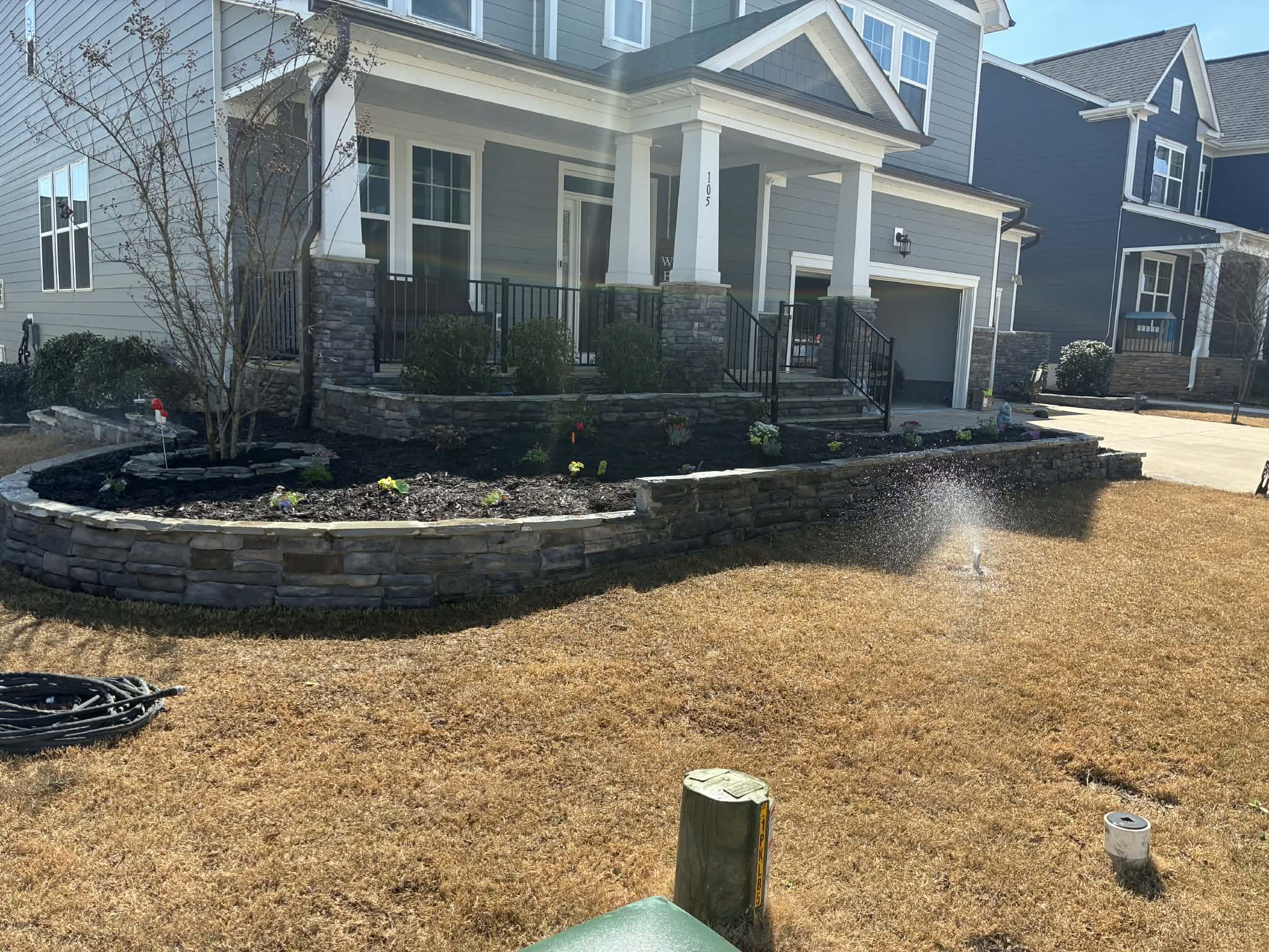 Home with stone planters