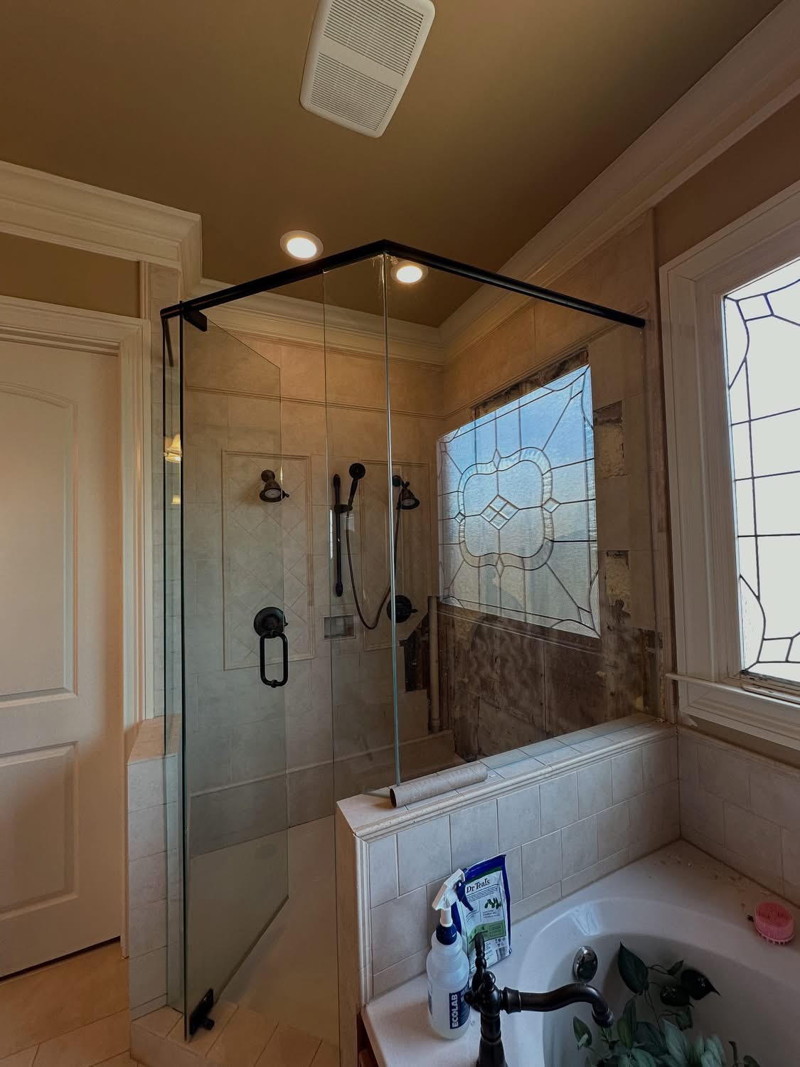 Clean bathroom shower with multiple showerheads