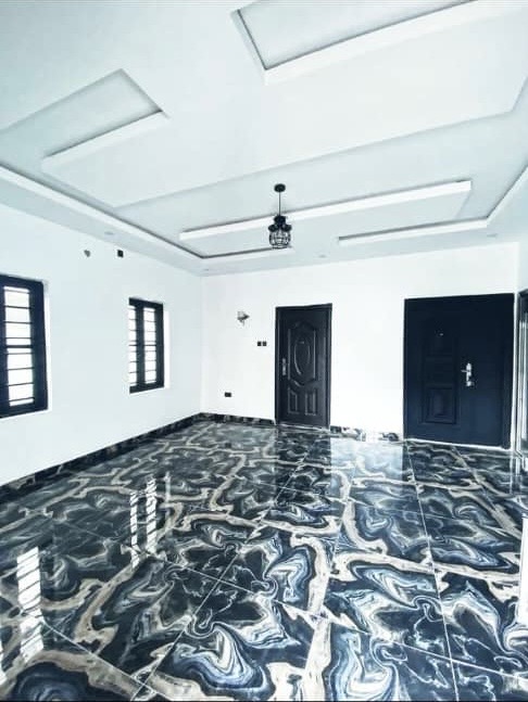 After: Clean modern room with marble floor and designed ceiling