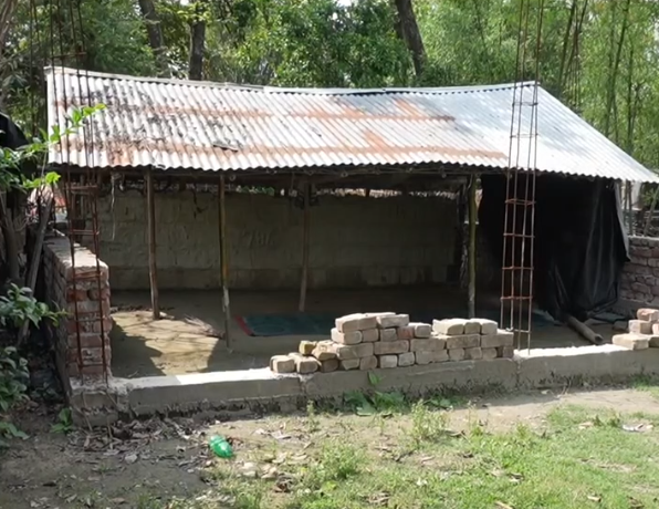 Rusty roof and unfinished walls of the hut